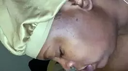 Side view of ebony bonnet working hard outdoors