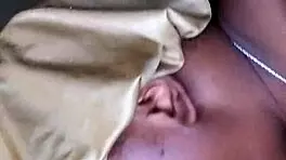 Side view of ebony bonnet working hard outdoors