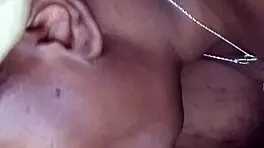 Side view of ebony bonnet working hard outdoors