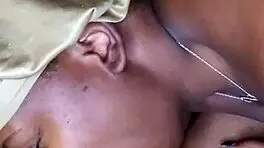 Side view of ebony bonnet working hard outdoors