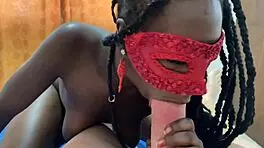 ebony teen performs solo act in suggestive manner