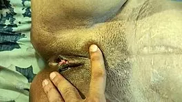 watch this couple fucking their shaved pussies hard