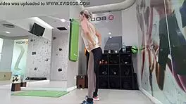 POV video of a young beauty stretching her legs at a gym