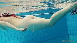 redheaded katrin teasingly stripping underwater 😏