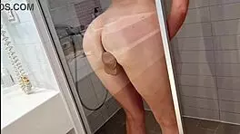 horny milf shoves dildo deep in shower