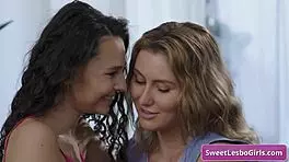 Horny lesbian babes Paige Owens and Liz Jordan kiss and rub clits