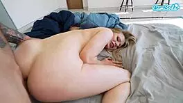 Young girl secretly hiding under the blankets being scolded by her mother