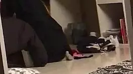 Young woman in dorm gives interracial blowjob