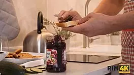 Handsome guy makes breakfast while wife worships his ass in kitchen.