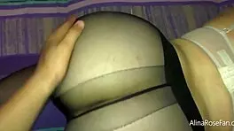 Large-buttocked she, young girl strips her nylon stockings to perform a sexual act