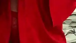 brunette in red lingerie plays with herself