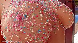 Kyra Hot using a vaginal toy gently pinched between her real breasts