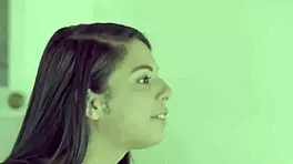 Young lesbians passionately tongue each other.