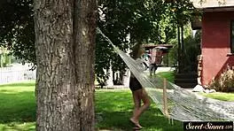 A beautiful naked teen sucks her stepbrother’s cock and pleasures him in chic nude socks outside
