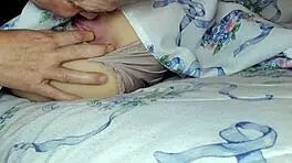 An old man satisfies a woman by licking her private parts and her anus when she wakes up