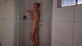 Hot MILF masturbates in the shower until she cums, releasing her load