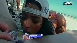 Friends Engage in Intimate Activities on Crowded Beach