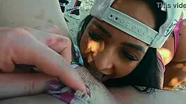 Friends Engage in Intimate Activities on Crowded Beach