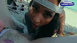 Friends Engage in Intimate Activities on Crowded Beach