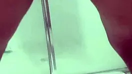 Teen bends over for juicy squirt in bathroom stall