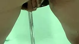 Teen bends over for juicy squirt in bathroom stall