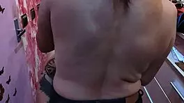 barber babe shows off natural tits