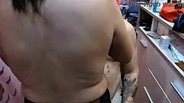 barber babe shows off natural tits