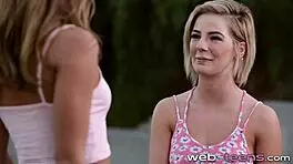 petite lesbian in a private session rubbing gently with another