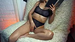 Wife reads erotic stories while caressing herself to orgasm