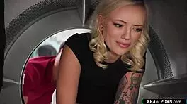 Blonde stuck in laundry machine offers blowjob for help.