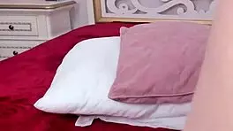 Young blonde dances sensually in candlelit room