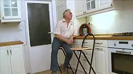 Youthful beauty casually blows old pecker in a relaxed setting.