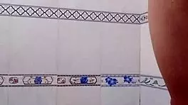 Detailed scene of a person bathing alone in private setting