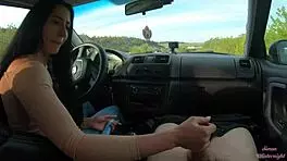 Teen brunette gets public car handjob from big cock friend