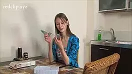 Intriguing Russian teen playing with a toy curiously.
