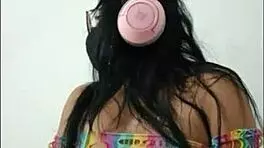 opening her pussy and inserting a pink dildo she shows her wet pussy