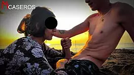 brunette latina babe gives pov blowjob on public beach