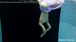 Blackhaired Aneta Relaxing In The Pool