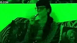 Beth kinky sexy goth domina smoking in green light