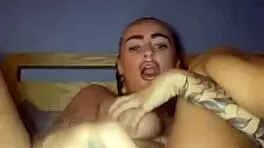 Tattooed goth slut fingers herself raw