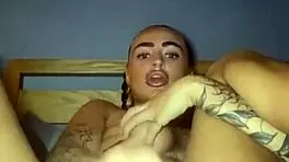 Tattooed goth slut fingers herself raw