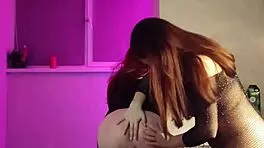 Two busty milfs rub wet pussies in kitchen, big asses grinding passionately