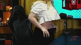 blonde bends over podcast table as tiny panties reveal her soaked pussy