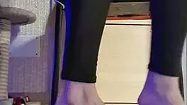 Woman in Black Leggings Teases with Subtle Fingering