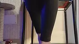 Woman in Black Leggings Teases with Subtle Fingering