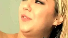 Busty blonde teen teases with her mouth near the edge