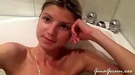 german blonde poses erotically with clothes ripped off