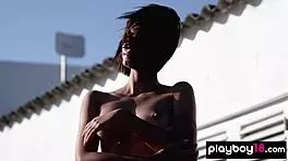 Skinny brunette Ariel boldly strips bikini exposing small tits shaved pussy outdoors