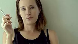 Petite Brunette Teases Smoking with Blue Eyes Voyeur