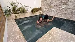 Two horny Colombians finger wet pussies publicly at pool risking exposure